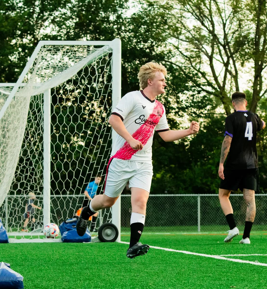 A Wheaton Wanderers FC player on the ball in midfield